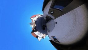 Little Tiny Planet 360 Small World View Of A Man Walking Urban Citywide in 4K