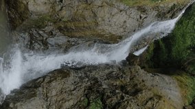Vertical video, slow motion: Andrew the Apostle waterfall in the mountain - river or stream of water flowing and falling down in Batumi, Georgia. Nature, landscape and environment concept - Powered by Shutterstock - Get 15% off with code: PIKWIZARD15