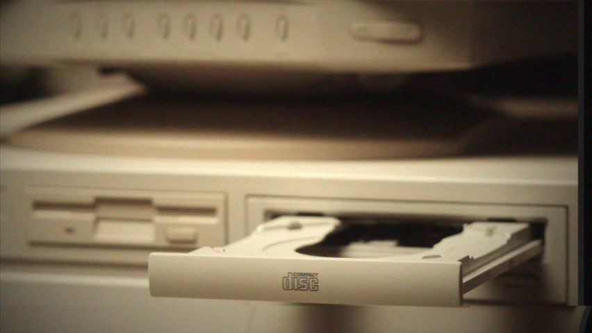 Vintage Retro PC, Using cd diskette for old computer. Music recorder, playing retro computer games. Vintage device for office, obsolete technology.  Royalty-Free Stock Footage #1101011509