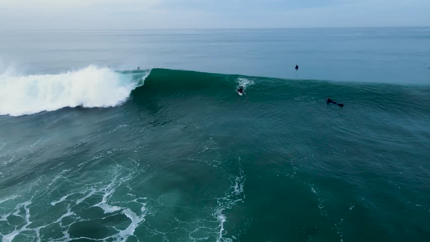 drone view of an unrecognizable surfer in San Diego