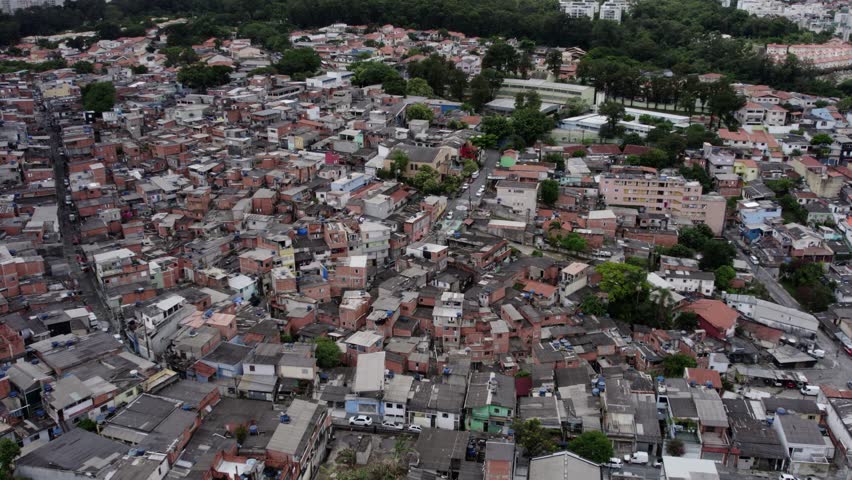 Aerial over slum homes in a needy district of Sao Paulo, gloomy day in Brazil