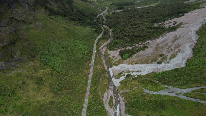 Milford Road to Milford Sound, aerial of New Zealand scenic drive, high mountains landscape.
