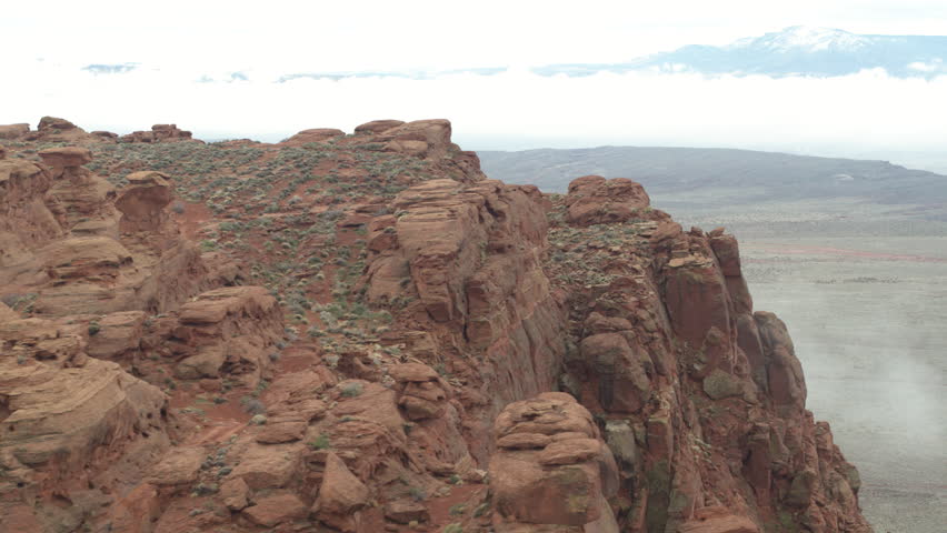 Aerial above Sand Hallow OHV area and four wheeling dirt trail in southern Utah on misty winter day