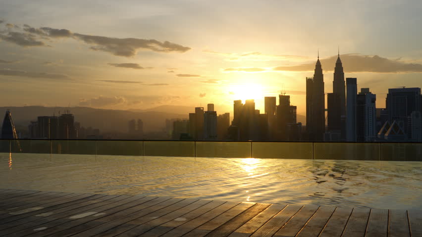 Asian woman in red dress and morning view and sunrise at Kuala Lumpur, Malaysia