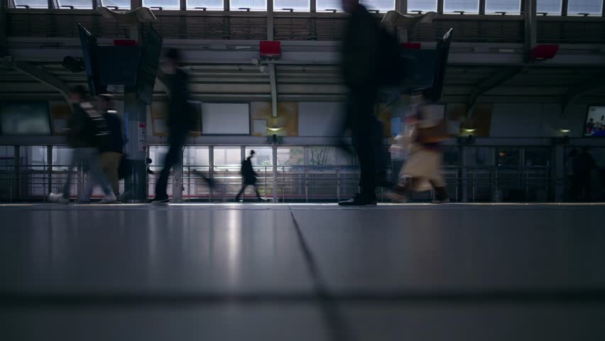 time lapse of Commuters Walking in Dark railway station, subway train Platform crowded with business workers at rush hour, depressing urban environment Royalty-Free Stock Footage #1101022299
