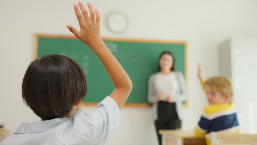 Group of student learn with teacher in classroom at elementary school. Attractive beautiful female instructor master explain and educate young children with happiness and fun activity at kindergarten. | Shutterstock HD Video #1101023963