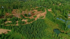 Work in progress in green forest. Aerial drone view	