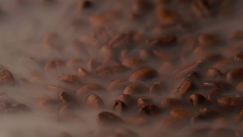 Slow-motion Coffee beans in rotation  | Shutterstock HD Video #1101035247