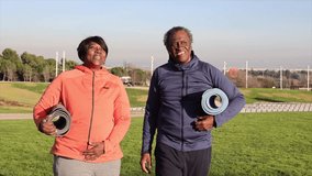 African American couple preparing to do yoga outdoors - Powered by Shutterstock - Get 15% off with code: PIKWIZARD15