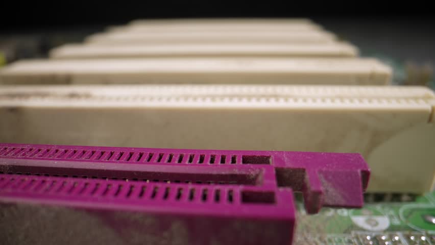 Old motherboard from a disassembled computer. Dolly shot Closeup