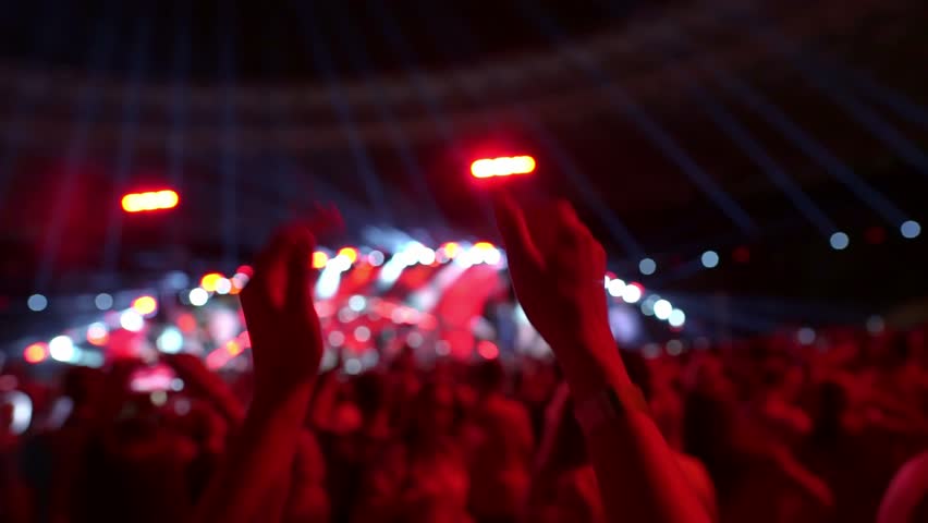 Fans applaud in front of the stage at a concert. Royalty-Free Stock Footage #1101056255