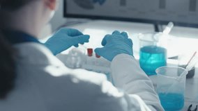 Medical research laboratory. A scientist works with a pipette and a test tube. Scientific laboratory of biotechnology, development of medicine and research in chemistry, biochemistry and experiments. - Powered by Shutterstock - Get 15% off with code: PIKWIZARD15