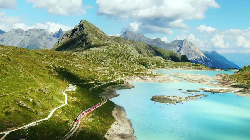 Drone Switzerland 4k. Swiss Alps. Rhaetian Railway famous Lake Bianco on way to St. Moritz. Switzerland summer tourism. Royalty-Free Stock Footage #1101056935
