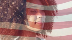 Animation of flag of usa over smiling african american woman on beach. American patriotism and diversity concept digitally generated video.
