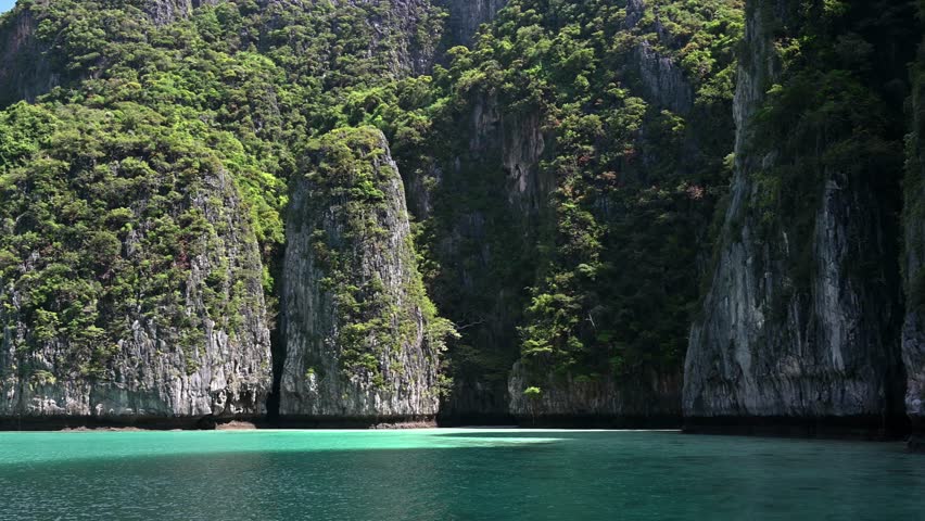 Tropical islands view with ocean blue sea water at Pileh Lagoon of Phi Phi Islands, Krabi Thailand nature landscape Royalty-Free Stock Footage #1101060371