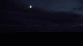 Car driving under crescent moon at dusk Iceland - Powered by Shutterstock - Get 15% off with code: PIKWIZARD15