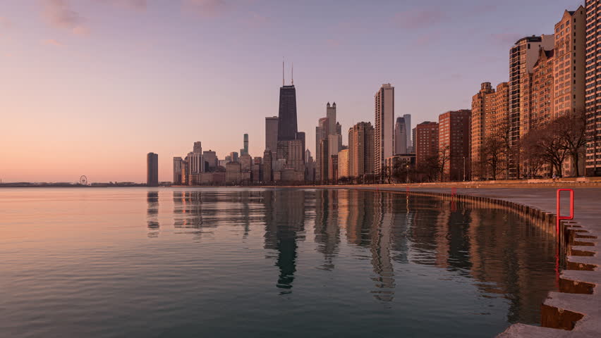 Chicago, Illinois, Usa - April 3 2022: Night to Day timelapse of the skyline of Chicago with the John Hancock Center and other skyscrapers