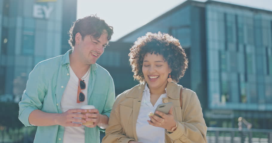 Smartphone, employees and friends walking in city, conversation and connection for social media. Young people, professionals and coworkers with cellphone, town and talking with happiness and urban Royalty-Free Stock Footage #1101072305