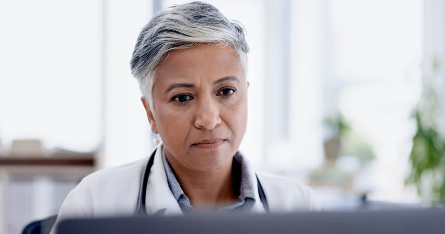 Healthcare, laptop and woman doctor doing research in office in the hospital after consultation. Technology, professional and senior female medical worker analyzing test results in a medicare clinic. Royalty-Free Stock Footage #1101072899