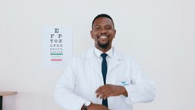 Face, black man and optometrist with smile, arms crossed and success in hospital with confidence. Portrait, African American male employee or medical professional with leadership, happy or healthcare - Powered by Shutterstock - Get 15% off with code: PIKWIZARD15