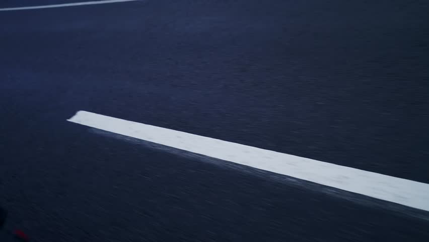 White Lines Of Road Markings On Gray Asphalt View From A Moving Car. Organizing Safe Traffic To Prevent Accidents. Traffic Rules. Royalty-Free Stock Footage #1101078963