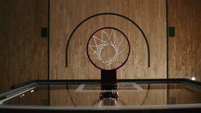 Male Athlete Executing a Slam Dunk At An Indoors Basketball Court, Camera Looking Down Over The Net, Top Down - Powered by Shutterstock - Get 15% off with code: PIKWIZARD15