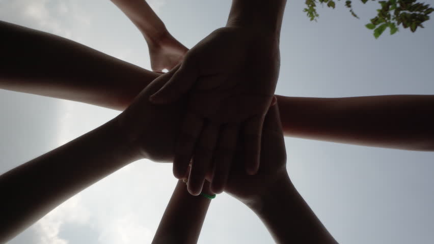 Successful team, many hands holding together on sky background
 | Shutterstock HD Video #1101082005