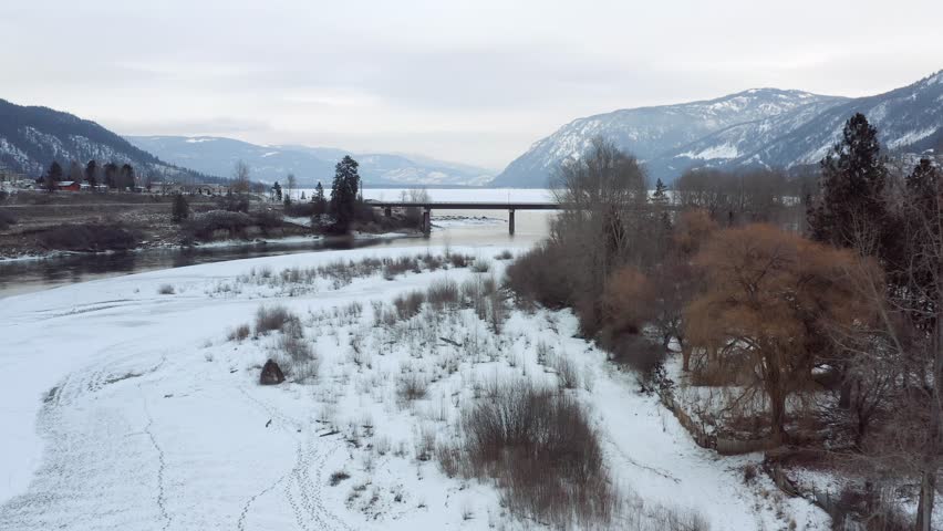 Breathtaking Winter Scenery: Drone Footage of South Thompson River Bridge and Little Shuswap Lake in Chase, British Columbia