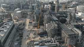 4k, hyper lapse circle drone shot, industrial plant construction project, crude oil and gas refinery new construction site large scale, aerial view,