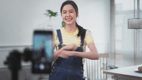 Asian young beautiful  woman streamer listening to music dancing and listening music at Home Interior, Residential Building.