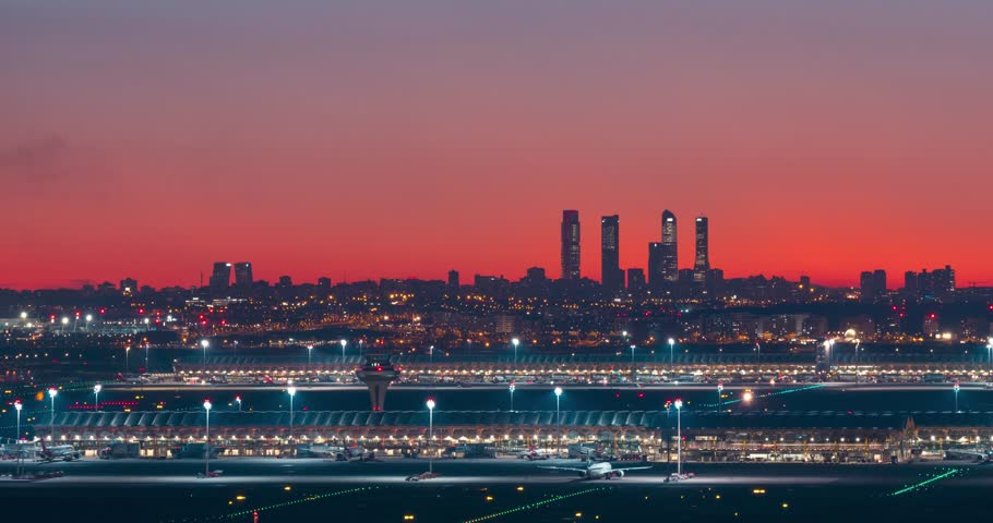 Timelapse Madrid skyline towers and Barajas airport silhouete during colorful sunset | Shutterstock HD Video #1101088729