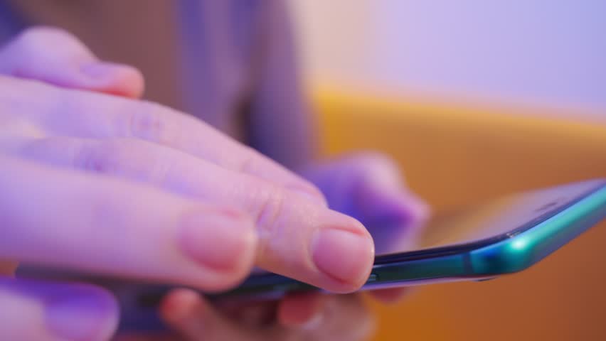Close up view of female hands using phone. girl