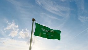 Flag of Saudi Arabia waving in the wind, sky and sun background. Saudi Arabia Flag Video. Realistic Animation.