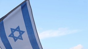Flag of Israel Video. Waving Israeli Flag Slow Motion Video. Israel Flag on the blue sky background with clouds 