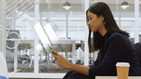 Animation of interface with data processing over asian woman using digital tablet at office. Computer interface and business technology concept - Powered by Shutterstock - Get 15% off with code: PIKWIZARD15