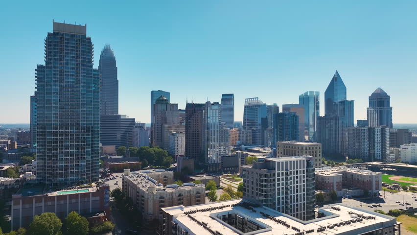 Aerial view of downtown district of Charlotte city in North Carolina, USA. Glass and steel high skyscraper buildings in modern american midtown