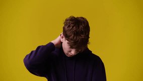 4k video of one man posing for a video over yellow background.