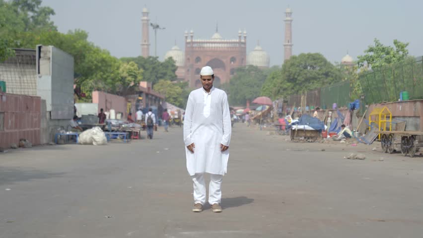 Muslim man reading Namaz during the day on the festival of eid