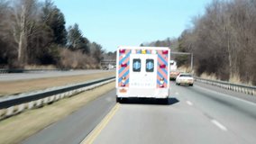 Ambulance in street downtown Medical service in their way to the hospital concept health service