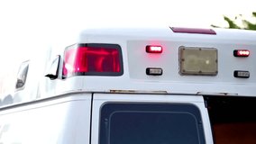Flashing light strobe on emergency ambulance car service vehicle. public safety background