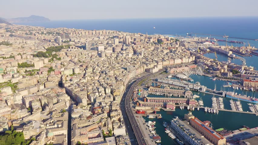 Inscription on video. Genoa, Italy. Central part of the city, aerial view. Ships in the port. Text from small balls, Aerial View