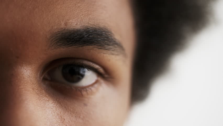 Closeup of African American man's eye looking into camera, genetics, human race | Shutterstock HD Video #1101110781