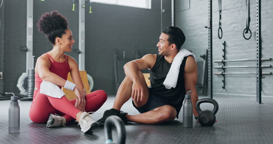 High five, fitness and happy man and women water drink after training workout in gym together. Healthy sports coach, exercise motivation partnership goal success and target team hydrate on floor Royalty-Free Stock Footage #1101116817