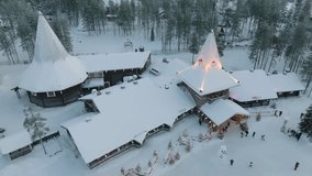 Santa Claus Village Shooting at Santa Claus near Rovaniemi in Lapland - Finland. Ice hotel with ice bar and restaurant services. carved ice walls. drone videos. Night at Santa Claus. Lights and snow. 