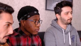 Close-up view of young people eating by watching their surroundings, black man and his friends sitting together eating burritos - Powered by Shutterstock - Get 15% off with code: PIKWIZARD15