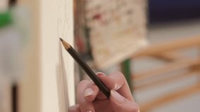 Vertical video. Drawing art. Creative hobby. Talent skill. Closeup of female artist hand using graphite pencil for sketching artwork on canvas. - Powered by Shutterstock - Get 15% off with code: PIKWIZARD15