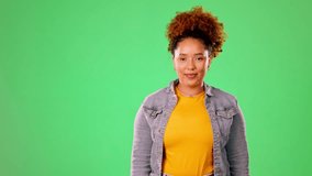 Happy woman pointing to green screen isolated on studio background for product placement, mockup or promotion. Young person or excited model face showing mock up chromakey space for gen z information - Powered by Shutterstock - Get 15% off with code: PIKWIZARD15