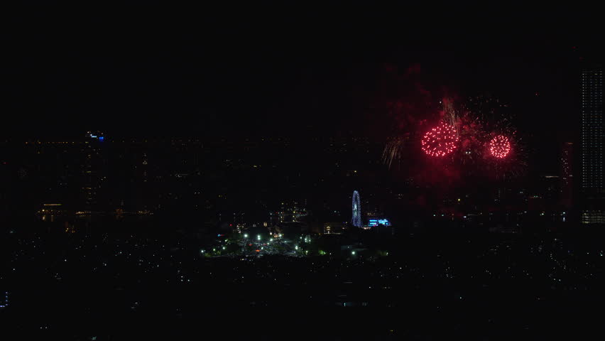 2022 December 31 Bangkok thailand countdown night colorful fireworks light happy new year holiday beside river with landscape tower city landmark hotel top view festival explosion dark black sky.
