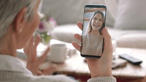 Mother, phone and video call with daughter, happy and smile while having a conversation on a sofa. Lockdown, quarantine and technology bringing family together with 5g network for loving females