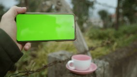 Green Screen Smartphone: Indulging in Coffee and Tea Time While Watching Videos
